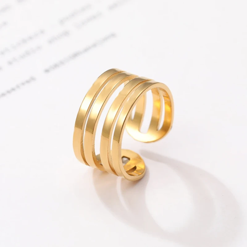 Pozłacany pierścionek uniwersalny cztery paski - stal chirurgiczna